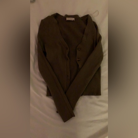 Green cardigan type button up. Its a bit itchy so you should wear a tank under. - Picture 1 of 3